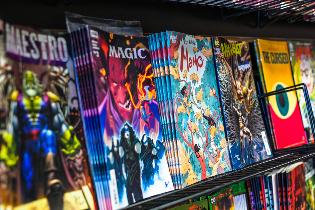 A close up image of the single issue comic wall at Third Eye Short Pump. Featuring a Marvel Maestro comic, a Magic the Gathering comic, a comic series by Boom Studios and more.